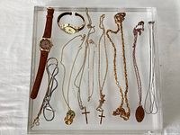 Overall view of all jewelry pieces on acrylic tray