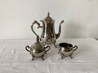 Full view of three-piece silver plate tea service