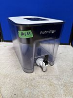 Front view of Waterdrop filter dispenser showing spigot and brand logo