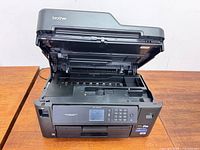Printer overall with lid open showing scanner bed and control panel