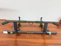 Full view of assembled KAKICLAY pull-up bar on table