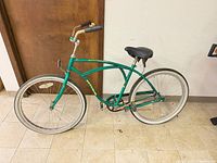 Full left-side view of bicycle showing frame, wheels, overall condition
