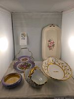Group shot of all seven pieces in lot