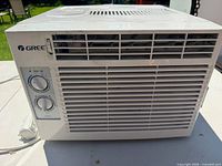 Front view showing grille and control knobs