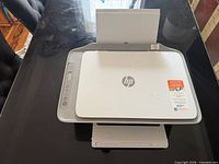 Top view of HP all-in-one printer on table