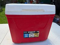 Front view of Igloo 28-quart red/white cooler showing logo and capacity label