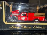Boxed red Liberty Classics 1938 Studebaker pickup, hood open, front angle