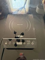 Top view showing Salton induction cooktop control panel and burner zone