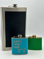 All three flasks grouped together for size and variety comparison