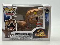 Front view of boxed Funko Pop Atrociraptor (Red) #1217