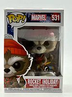 Front view of Funko Pop! Rocket Holiday box showing figure and label