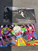 Both doormats laid out on ground, showing full designs