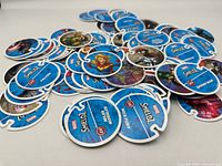 Pile of Marvel ShieldZ discs showing various characters