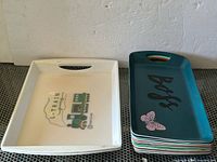 Two types of trays side by side for overall view