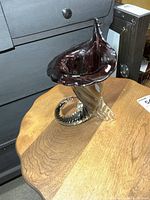 Side view of vase showing twisted clear base and amethyst upper section