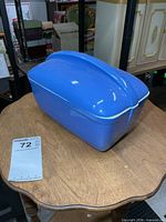 Blue porcelain refrigerator dish with lid displayed on table