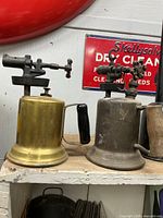 Front view of both fuel torches side by side on shelf
