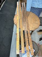 Top view of all four yardsticks showing full length and advertising text