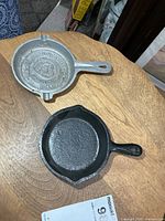 Top view of both pans showing materials, shapes, size relative to each other