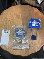 Both Labatt's Blue tap handles on tabletop