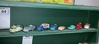 Shelf view showing all eight die-cast vehicles in lot