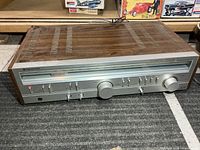 Front view of Kenwood KR-710 receiver showing full faceplate and wood cabinet