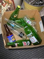 Box showing assortment of vintage soda bottles