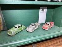 Three die-cast vehicles on shelf showing overall lot