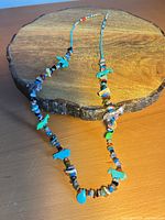 Full view of entire necklace laid out showing length and design