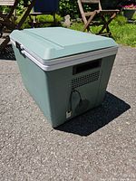 Cooler exterior showing front ventilation panel, power cord port