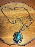 Full view of necklace laid flat on wood surface