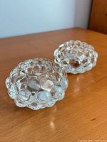 Two clear crystal bubble pattern tealight holders side view
