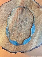 Full view of silver-tone necklace with turquoise chip inlay