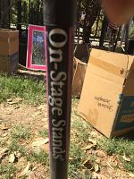 Close-up photo showing the On-Stage Stands brand label on the microphone stand pole.