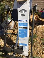 Full view of the long Philips light bulb packaging box showing product details including brand, bulb type, and wattage specifications