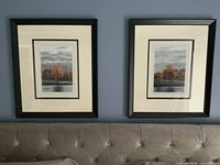 Both framed prints above headboard showing size and matching framing