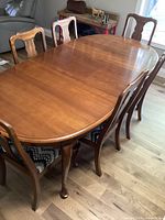 table fully extended with chairs around
