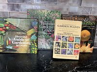 Front covers of the four gardening books