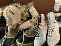 London Fog boots beside Daoust skates showing overall condition