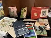 Overview of golf books and binders on table