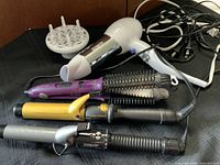 All five hair styling tools with cords visible