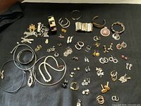 Overview of entire jewellery assortment on black fabric