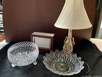 Group shot of lamp, two glass bowls, swivel photo frame