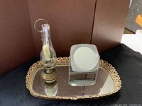 Silverplate tray, brass vanity tray, brass candle holder, magnifying mirror grouped