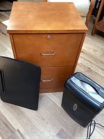 Filing cabinet, lap desk, and shredder grouped