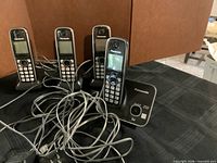 Four Panasonic cordless handsets with cords