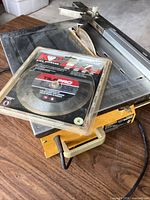 WorkForce tabletop wet tile saw with packaged 7" blade resting on table