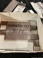 Boxed mesh-backed tile sheet showing Made in Italy text