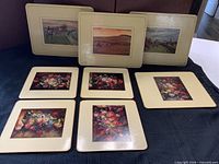 Seven trivets, front floral, back hunt scenes