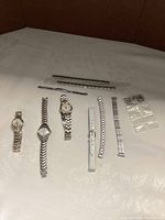 Overview of watches, bracelet segments, strap and clasps